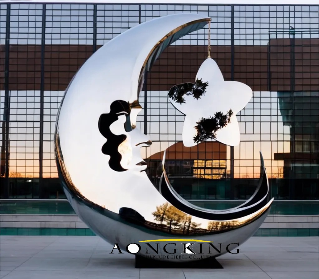 smiling moon metal sculpture with star